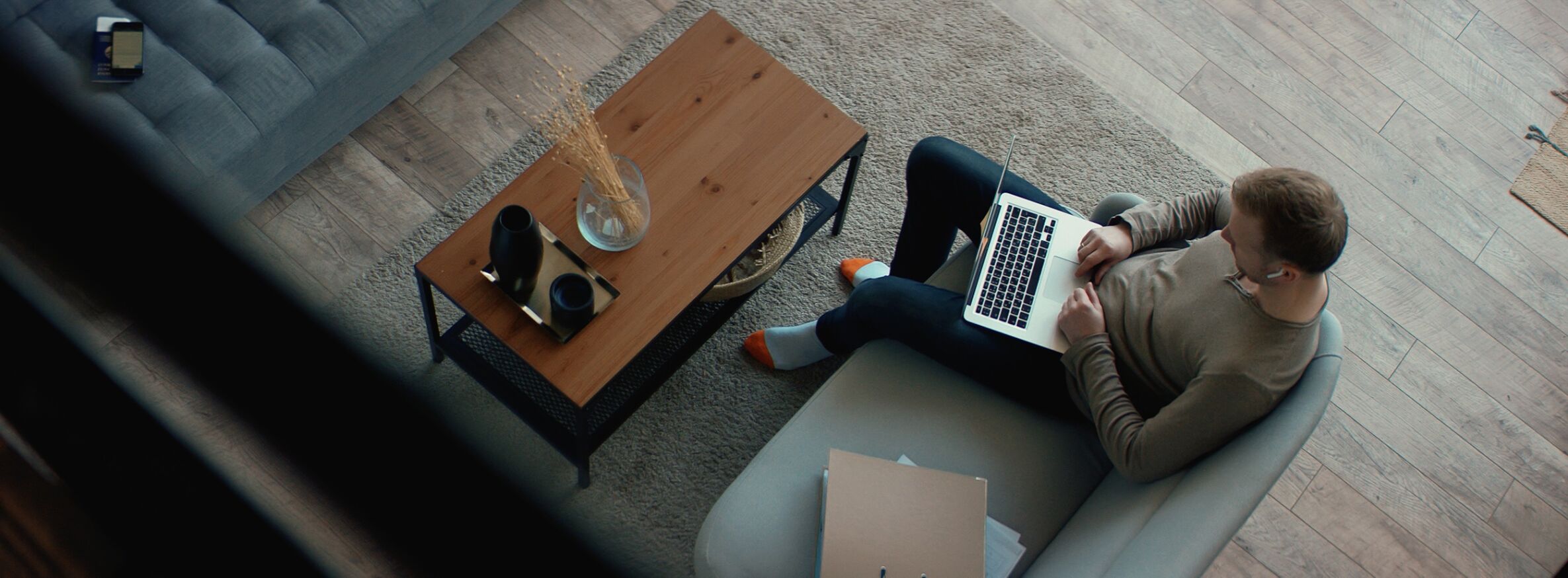 OVERHEAD Caucasian male remote working from home, having work confrence call